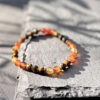 bracelet-cornaline-oeil-de-tigre-bien-etre-femmes_1476 Bracelet bien-être pour femmes en cornaline et œil de tigre, symbole d’équilibre, d’énergie et de force intérieure, réalisé à la main avec des pierres naturelles.