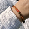 bracelet-cornaline-oeil-de-tigre-cadeau-original_1479 Bracelet en cornaline et œil de tigre, idée cadeau originale en pierres naturelles pour offrir confiance, protection et vitalité.