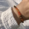bracelet-cornaline-oeil-de-tigre-pierre-protection-confiance_1481 Bracelet en cornaline et œil de tigre pour booster la confiance, la motivation et la créativité, un bijou énergétique unique en pierres naturelles.