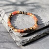 bracelet-protection-cornaline-oeil-de-tigre-fait-main_1473 Bracelet de protection en cornaline et œil de tigre, création artisanale en pierres naturelles, parfait pour renforcer le courage et attirer les énergies positives.